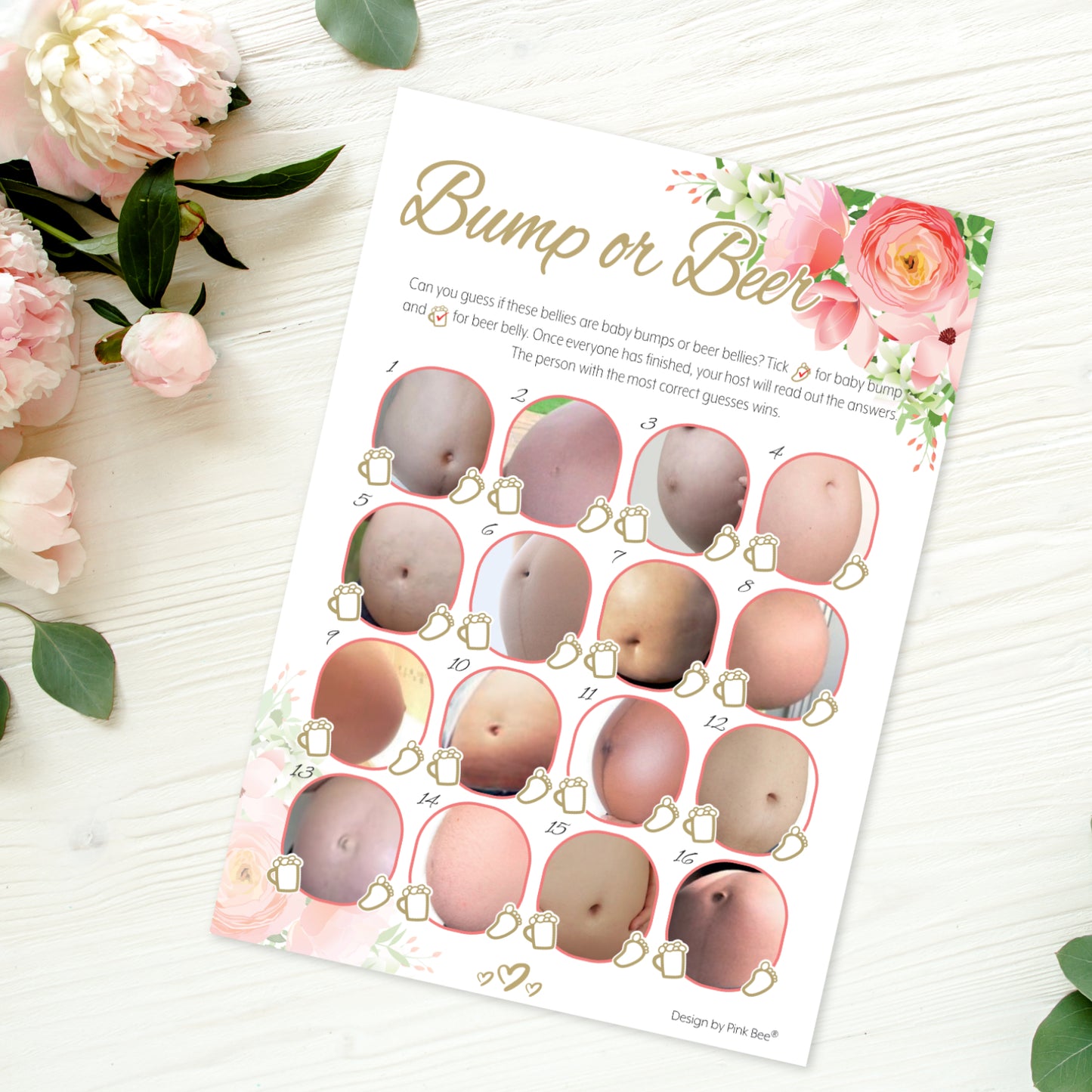 A single baby shower game sheet on a wooden table with peach flowers