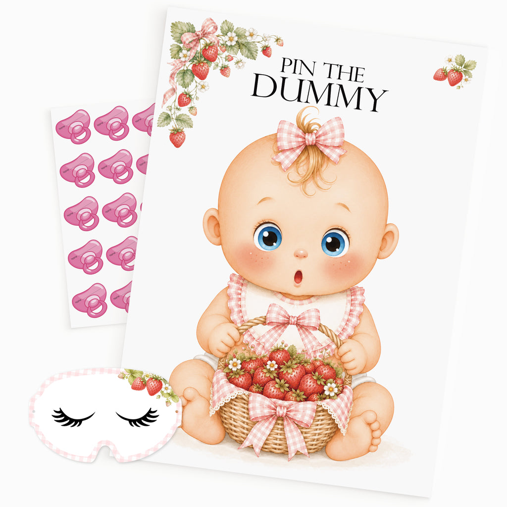 A baby-themed pin the dummy kit featuring a printed card with an illustration of a baby holding strawberries, a sheet of pink pacifiers, and a sleep mask with a strawberry and gingham border.