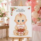 Berry Sweet Pin the Dummy baby shower game A2 strawberry poster displayed on wooden easel at pink baby girl shower