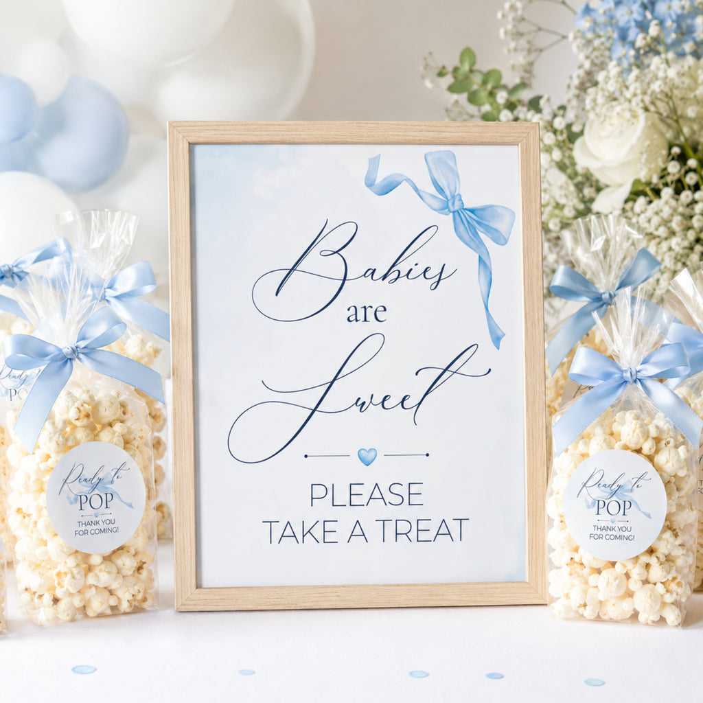 Blue Bow theme framed sign with 'Babies are Sweet' text, surrounded by popcorn bags with blue ribbons and labels.