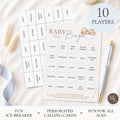 Baby Bingo party game set with a central bingo card, matching caller cards, a light blue pen, and a round badge reading '10 PLAYERS' on a styled flat-lay background.