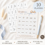 Baby Bingo party game set with a central bingo card, matching caller cards, a light blue pen, and a round badge reading '10 PLAYERS' on a styled flat-lay background.