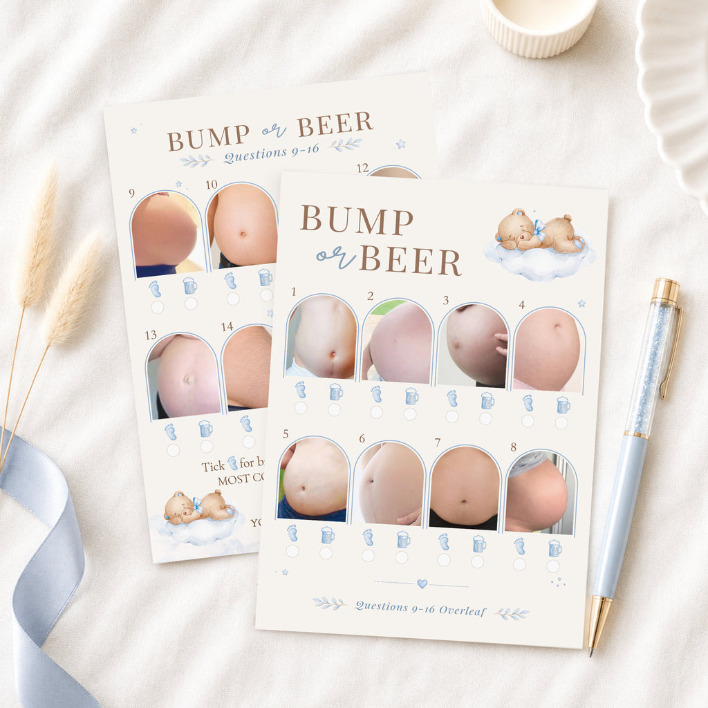 Blue Teddy Bear Bump or Beer double-sided baby shower picture quiz cards displayed on a neutral flat lay with blue ribbon and luxury pen.