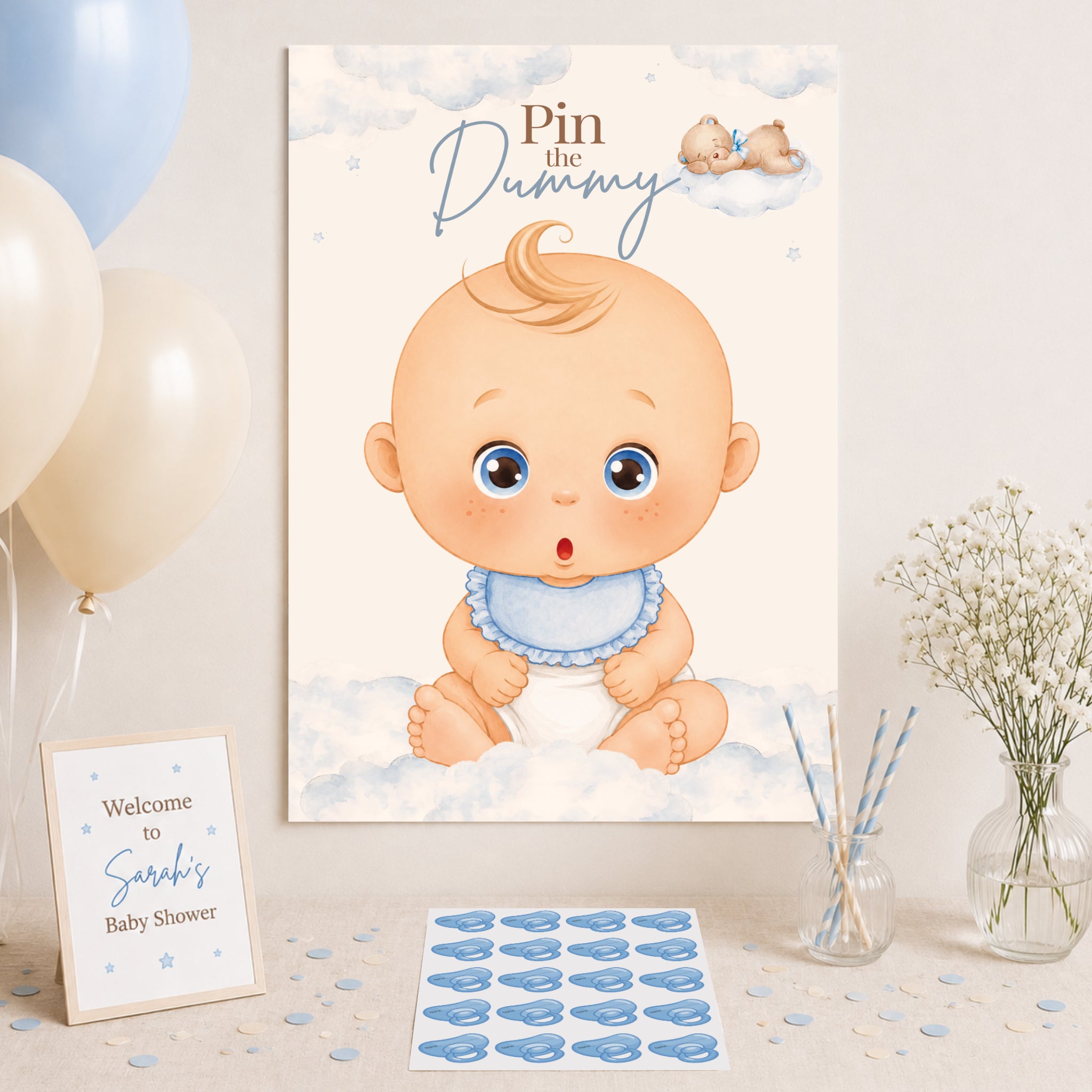 Blue teddy bear Pin the Dummy A2 baby shower poster with matching dummy stickers displayed as baby boy party decoration.