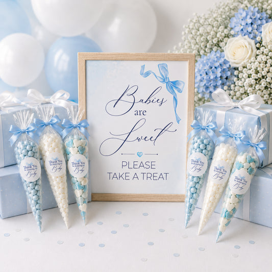 Blue bow baby shower favour sign displayed with sweet cones and matching thank you stickers, baby boy treat table decoration idea