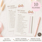 A set of 'Mummy or Daddy' baby shower game cards displayed on a light wood surface next to a pink ribbon and pen. The image includes promotional text overlays indicating '10 PLAYERS' and '16+ FUN QUESTIONS'.
