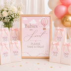 Pink hot air balloon baby shower favour sign with matching thank you stickers on guest gift bags