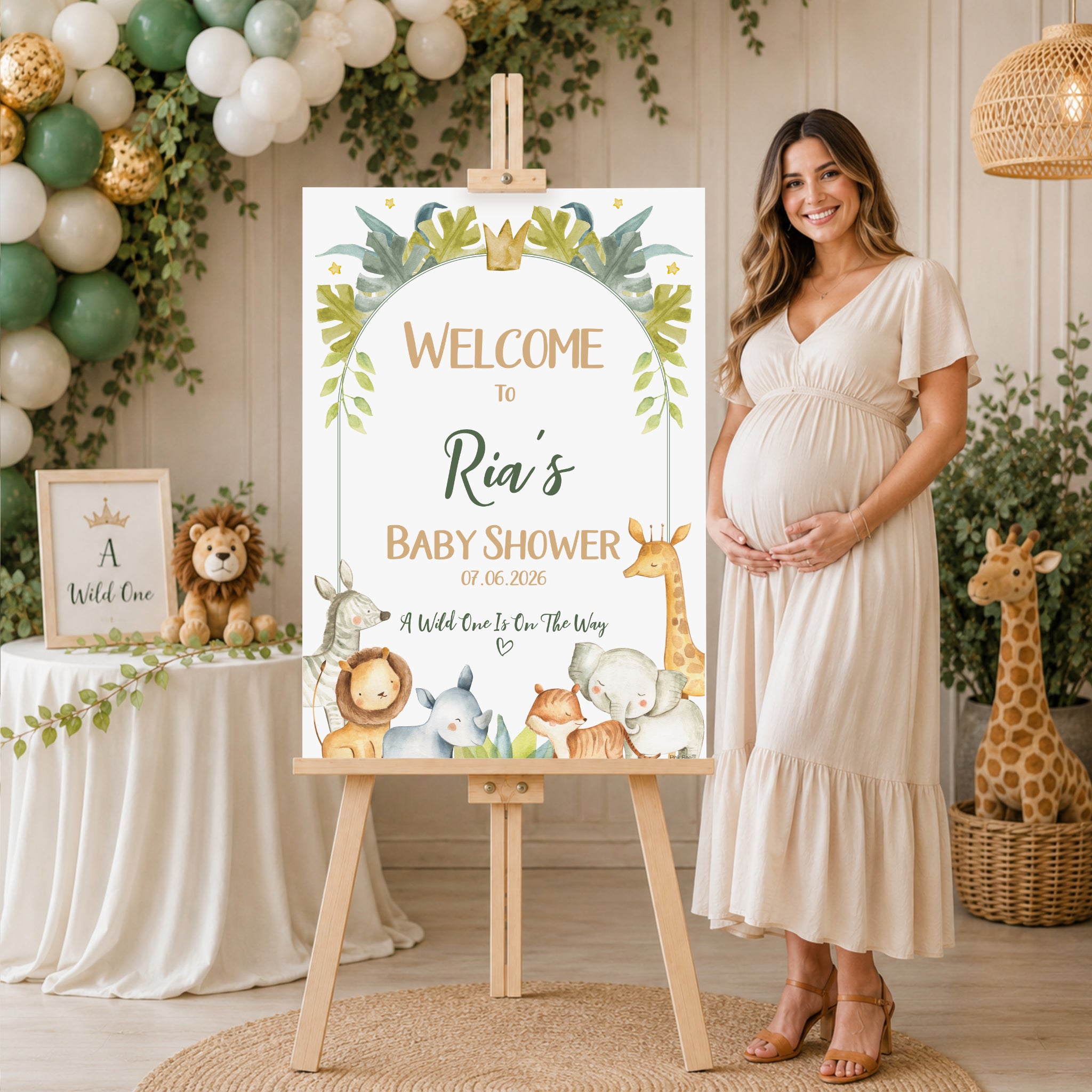 Personalised Safari baby shower welcome sign displayed beside expectant mother with elegant safari decorations, neutral jungle baby shower welcome board on wooden easel.