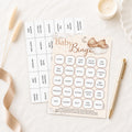Guest playing Teddy Bear Baby Shower Bingo during a baby shower using premium large bingo card and pen.