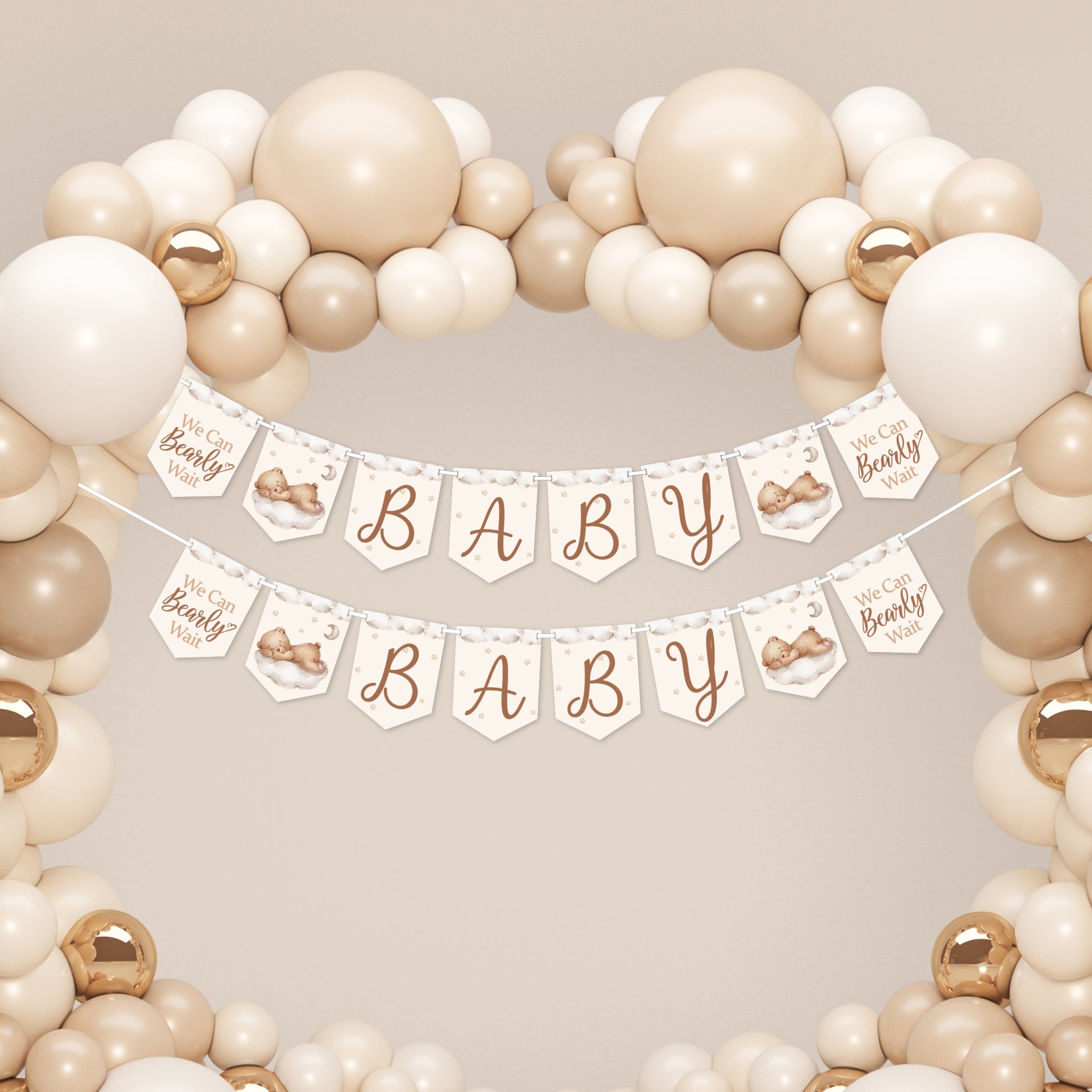 Two teddy bear baby shower banners displayed beneath a cream balloon arch for large baby shower venue decoration.