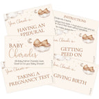 A set of baby shower charades cards with a soft cream background, brown text, and watercolor illustrations of a baby sleeping on a cloud next to a crescent moon. The cards are arranged in an overlapping fan layout on a white background.