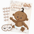 Ethnic teddy bear pin the dummy baby shower game contents showing A2 poster, dummy stickers and card blindfold.