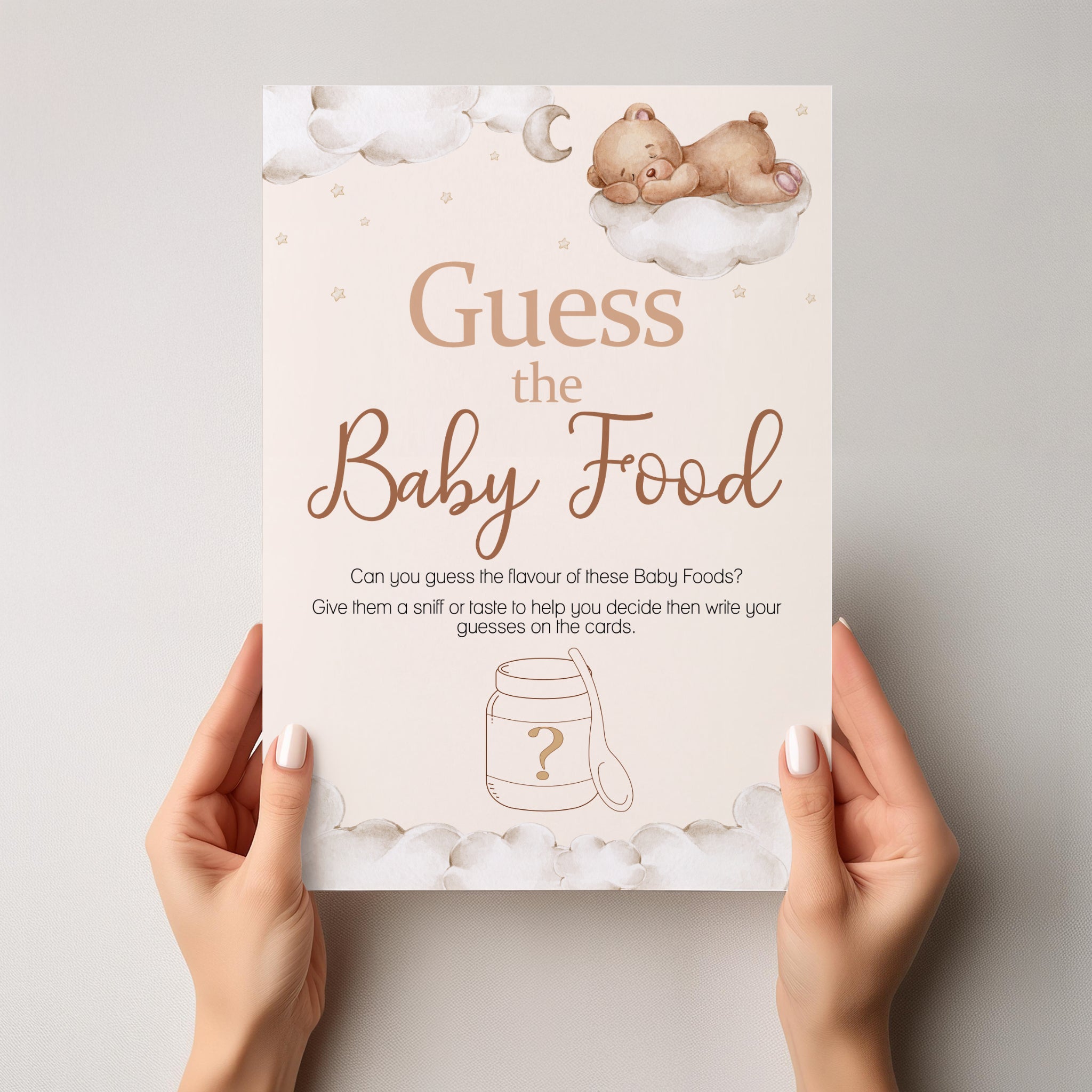 Close-up of Teddy Bear Guess the Baby Food A4 baby shower sign held in hands showing premium print quality.