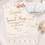 Flat lay Teddy Bear Guess the Sweet Mess baby shower game with A4 sign, guest cards, numbered nappies and stickers.