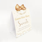 Folded Teddy Bear Guess the Sweets baby shower tent sign with elegant neutral teddy bear illustration.