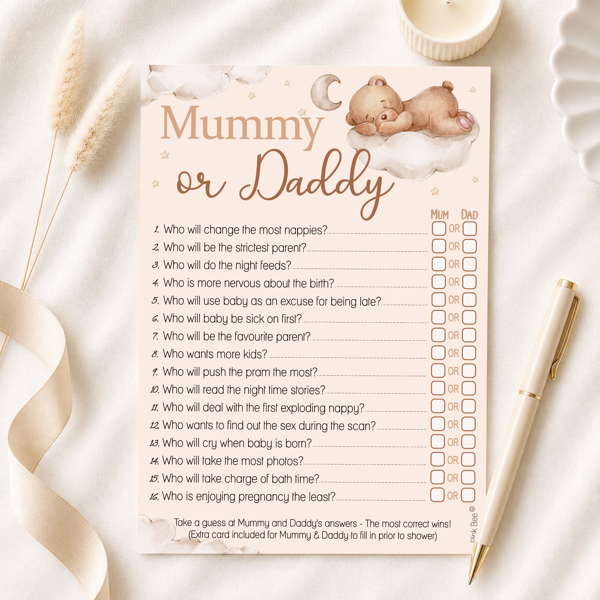 Teddy Bear Mummy or Daddy baby shower game displayed on linen background with pen showing premium quality 5x7 game card.