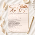 Teddy Bear Nursery Rhyme Quiz baby shower game card displayed on a neutral baby shower flat lay with pen.