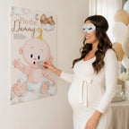 Guest wearing the included blindfold playing the Teddy Bear Pin the Dummy baby shower game with A2 poster.