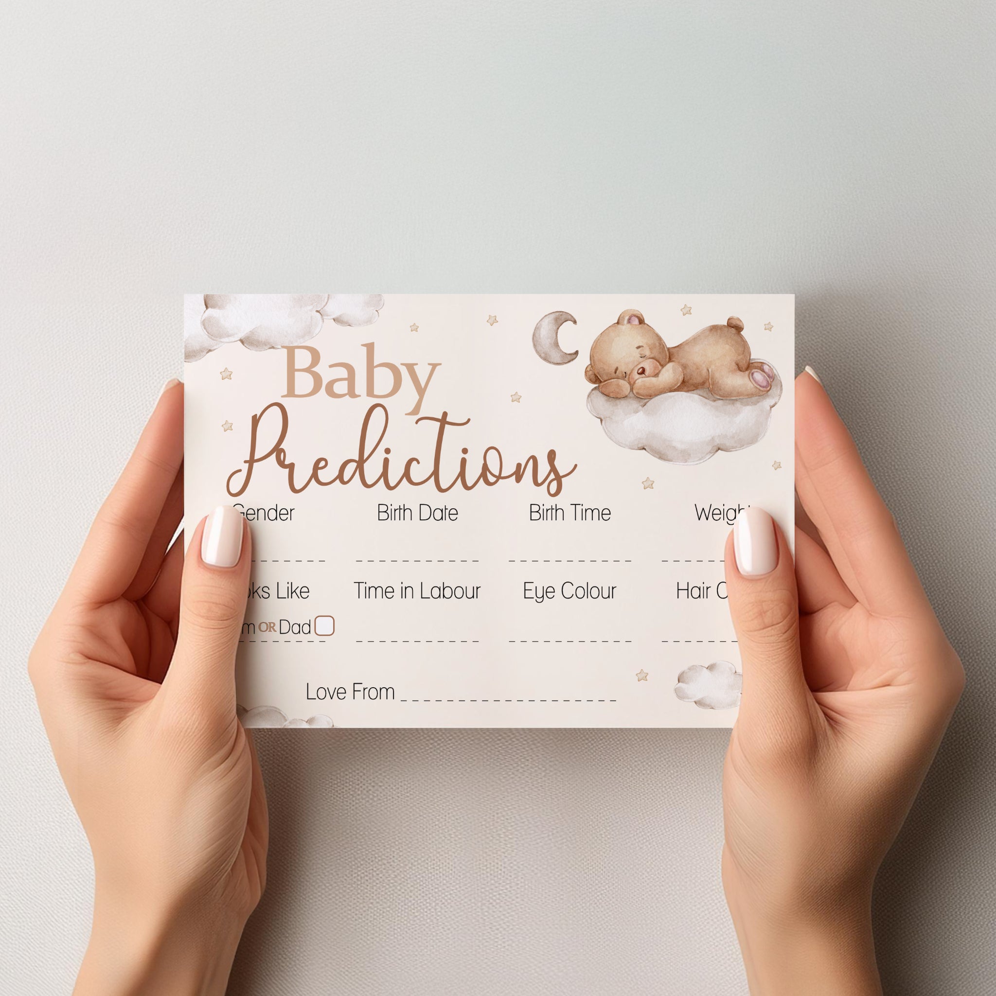 Hands holding Teddy Bear Baby Prediction Card showing premium A6 keepsake design for baby shower guests.